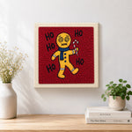 Finished dizzy gingerbread man with candy cane artwork displayed on a wall