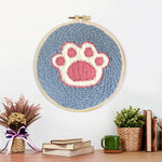 Finished dog paw print artwork displayed on a wall