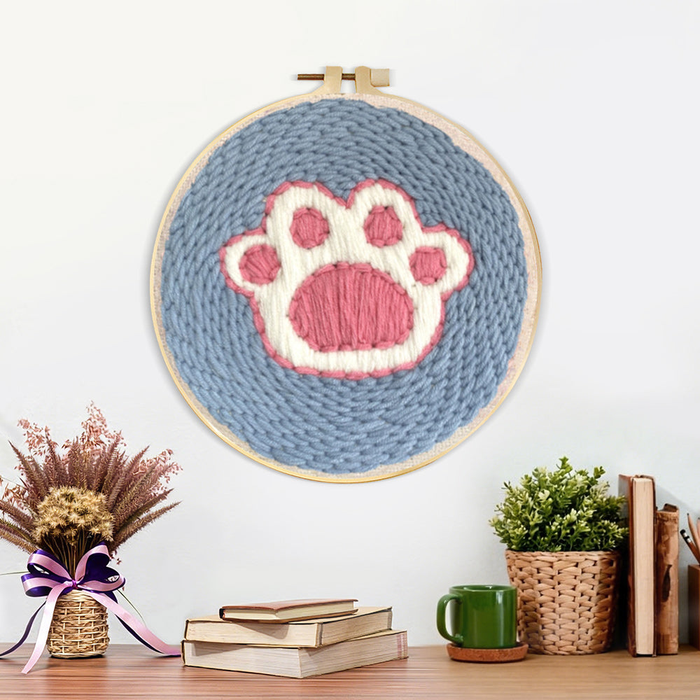 Finished dog paw print artwork displayed on a wall