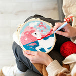 Creating handmade dreamy clouds, sea, and white deer punch needle artwork