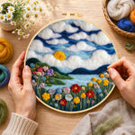 Creating the dreamy cloudscape and flower meadow wool painting by hand with a felting needle