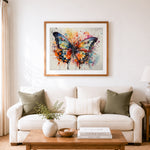 Finished dreamy splatter butterfly cross stitch artwork displayed as home decor
