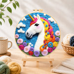 Finished dreamy unicorn and flowers needle felting displayed on a wooden easel
