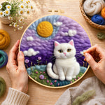 Creating the dreamy white cat in purple clouds wool painting by hand with a felting needle
