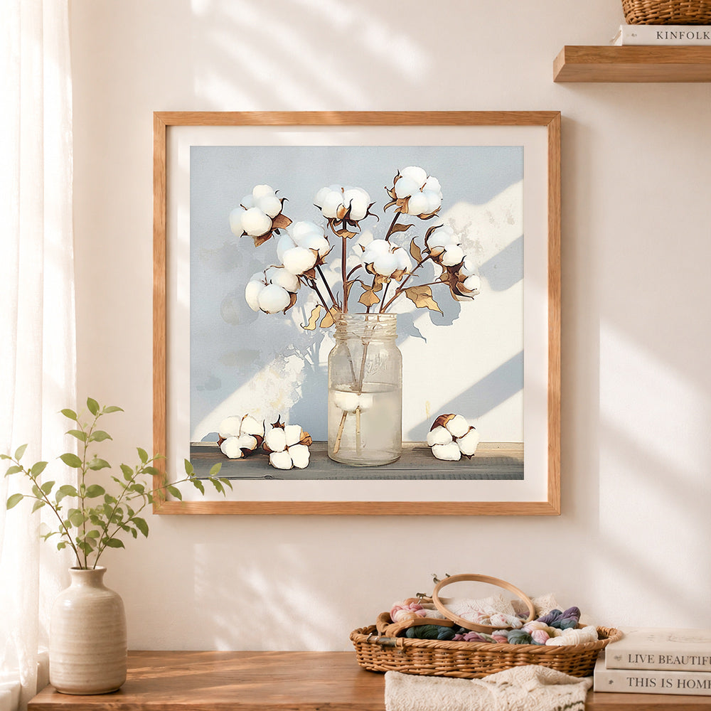 Finished dried cotton in glass jar cross stitch artwork displayed as home decor