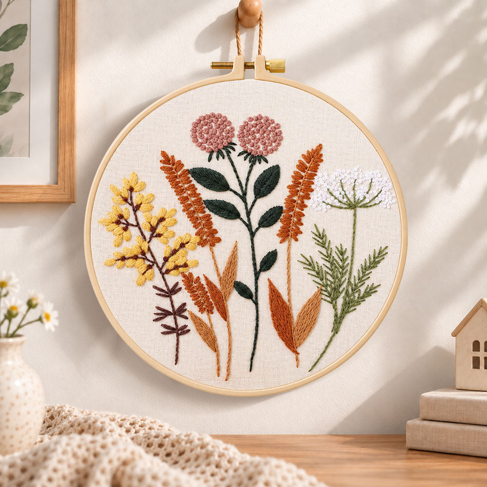 Dried wild florals embroidery hoop wall art displayed as warm and cozy handmade home decor