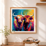 Finished dual highland cows in bold pop art cross stitch artwork displayed as home decor