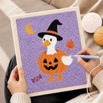 Creating handmade duck in pumpkin witch outfit punch needle artwork