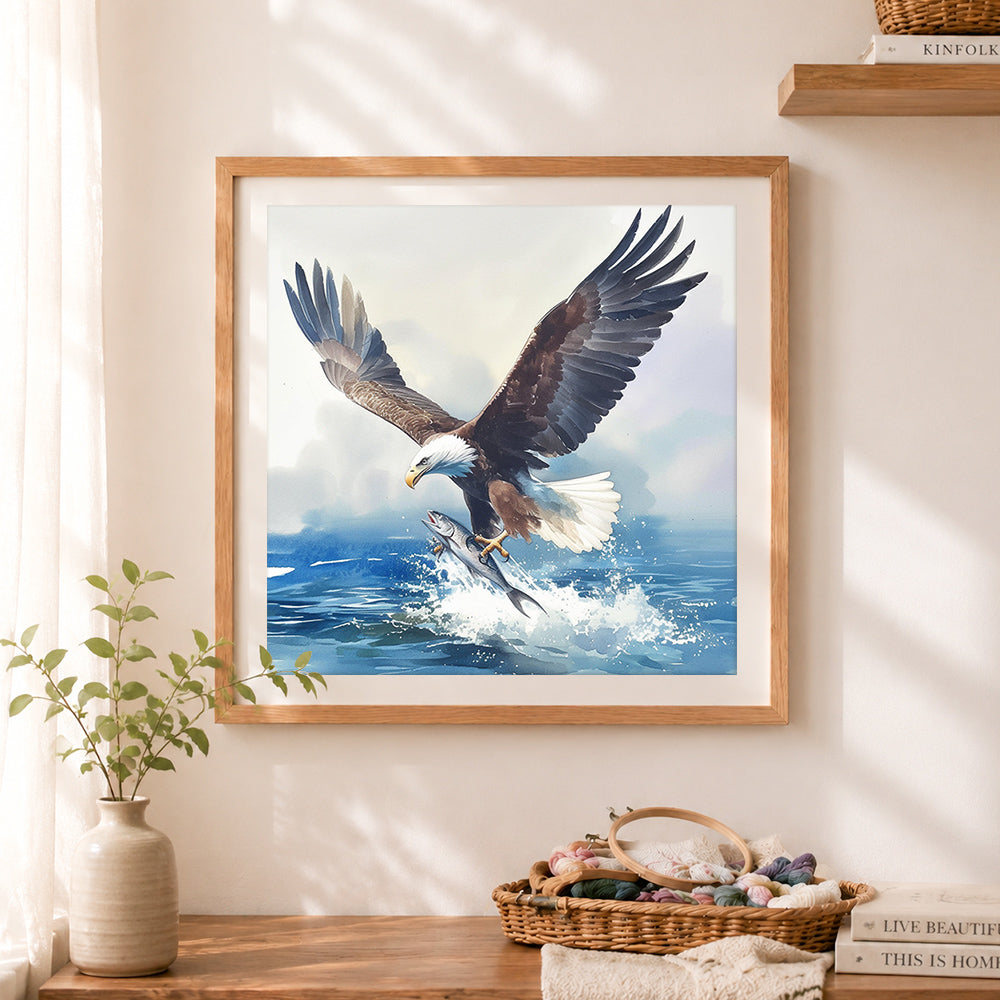 Finished dynamic bald eagle fishing cross stitch artwork displayed as home decor