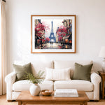 Finished eiffel tower street scene cross stitch artwork displayed as home decor