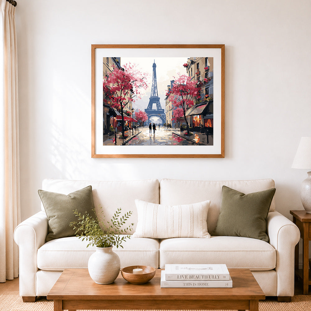 Finished eiffel tower street scene cross stitch artwork displayed as home decor