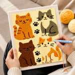 Creating handmade elegant four cats and paw prints punch needle artwork