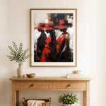 Finished elegant ladies in red cross stitch artwork displayed as home decor