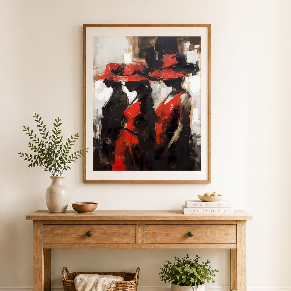 Finished elegant ladies in red cross stitch artwork displayed as home decor