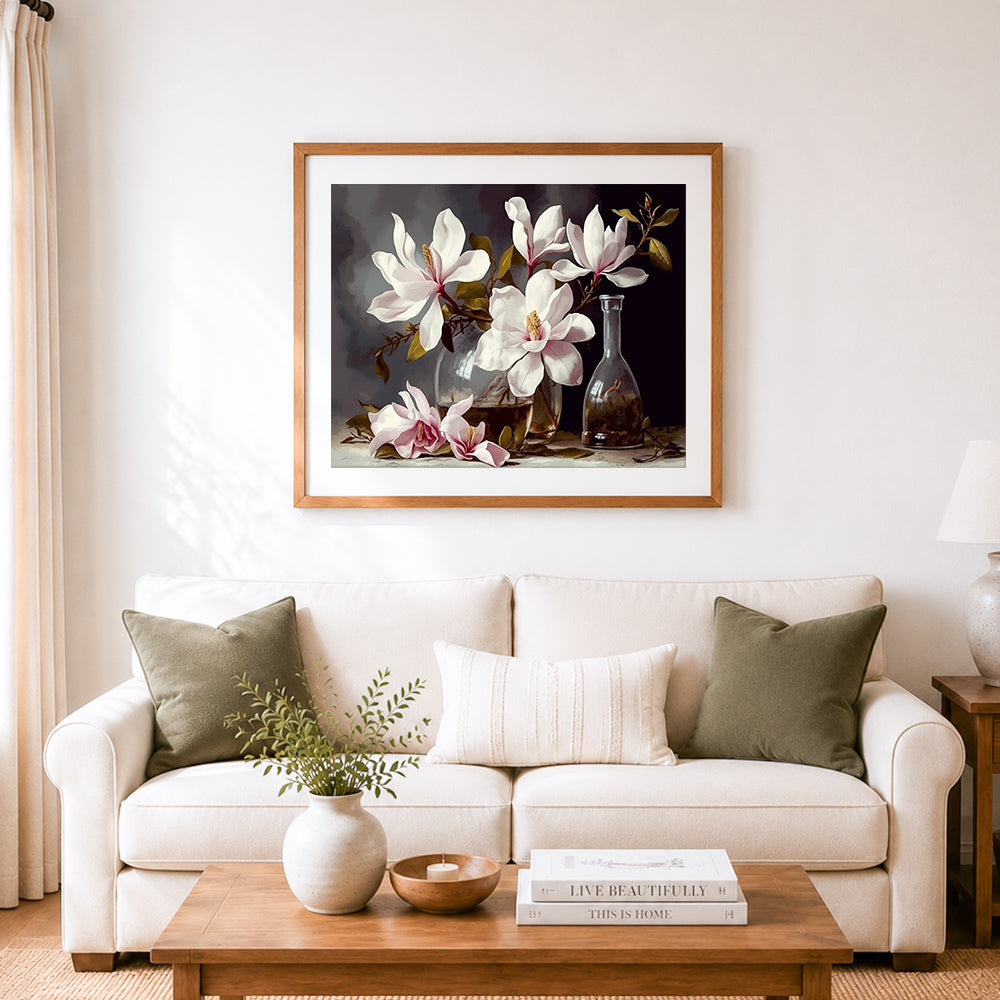 Finished elegant magnolia still life cross stitch artwork displayed as home decor