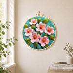 Elegant pink flowers needle felt wall art displayed in a bright home interior