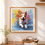 Finished energetic splash dog cross stitch artwork displayed as home decor