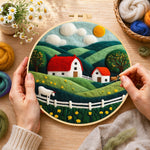 Creating the english cottage and rolling hills wool painting by hand with a felting needle