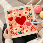 Creating handmade envelopes, hearts and cupid's arrow punch needle artwork