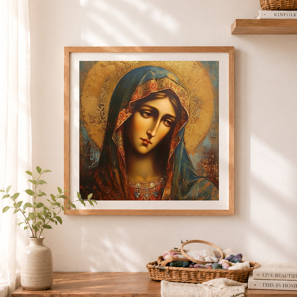 Finished ethereal blue veiled sacred portrait cross stitch artwork displayed as home decor