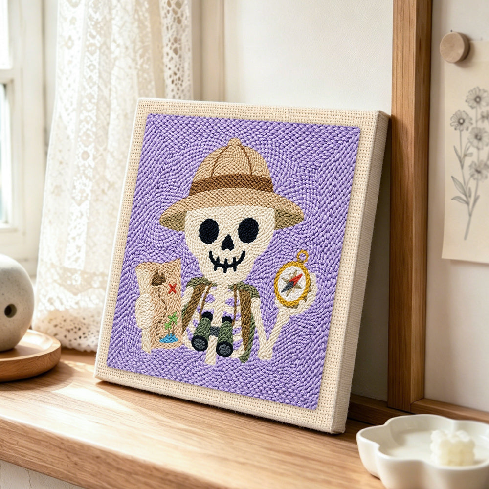 Explorer skeleton punch needle artwork displayed on a table