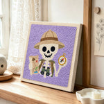 Explorer skeleton punch needle artwork displayed on a table