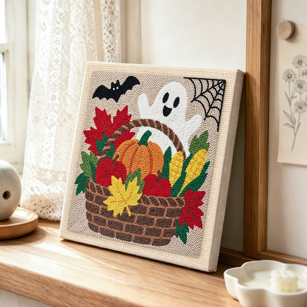 Fall harvest basket punch needle artwork displayed on a table