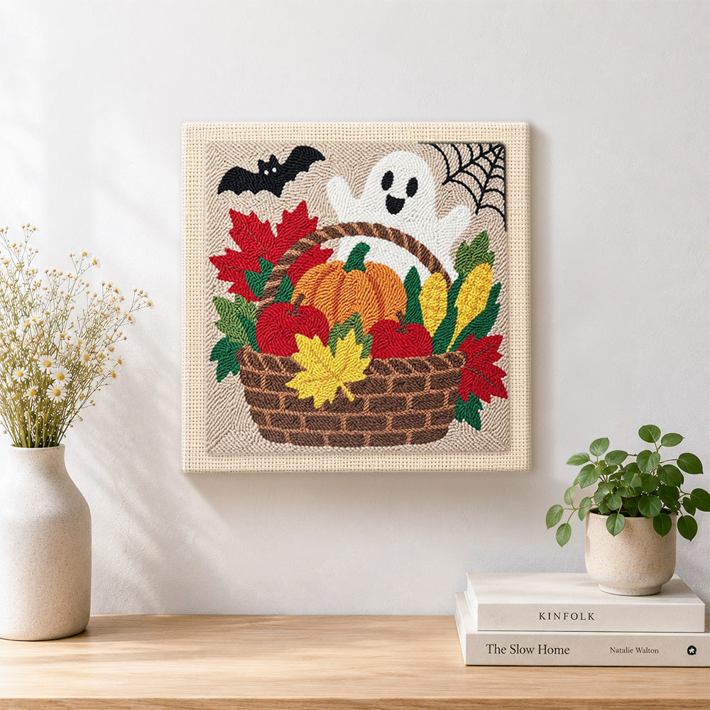 Finished fall harvest basket artwork displayed on a wall