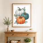Finished fall harvest pumpkins cross stitch artwork displayed as home decor