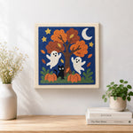 Finished fall tree ghosts artwork displayed on a wall