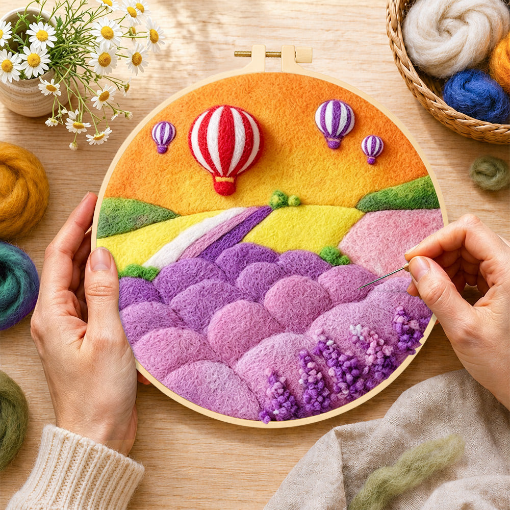 Creating the fantasy hot air balloon tour and pastel hills wool painting by hand with a felting needle