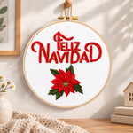 Feliz navidad poinsettia embroidery hoop wall art displayed as warm and cozy handmade home decor