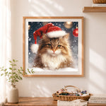 Finished festive cat in santa hat with snowflakes cross stitch artwork displayed as home decor