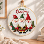 Festive christmas gnomes embroidery hoop wall art displayed as warm and cozy handmade home decor