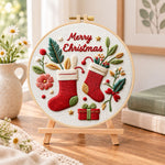 Festive christmas stockings embroidery kit finished hoop displayed on a wooden stand as cozy tabletop decor