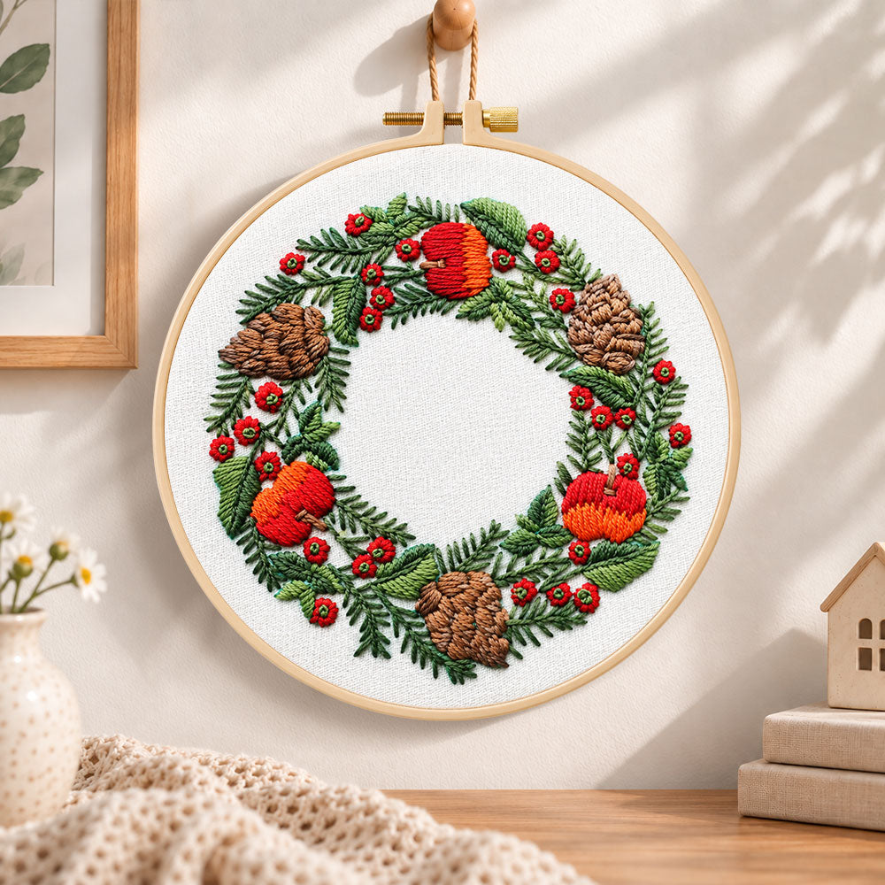 Festive fruit wreath embroidery hoop wall art displayed as warm and cozy handmade home decor