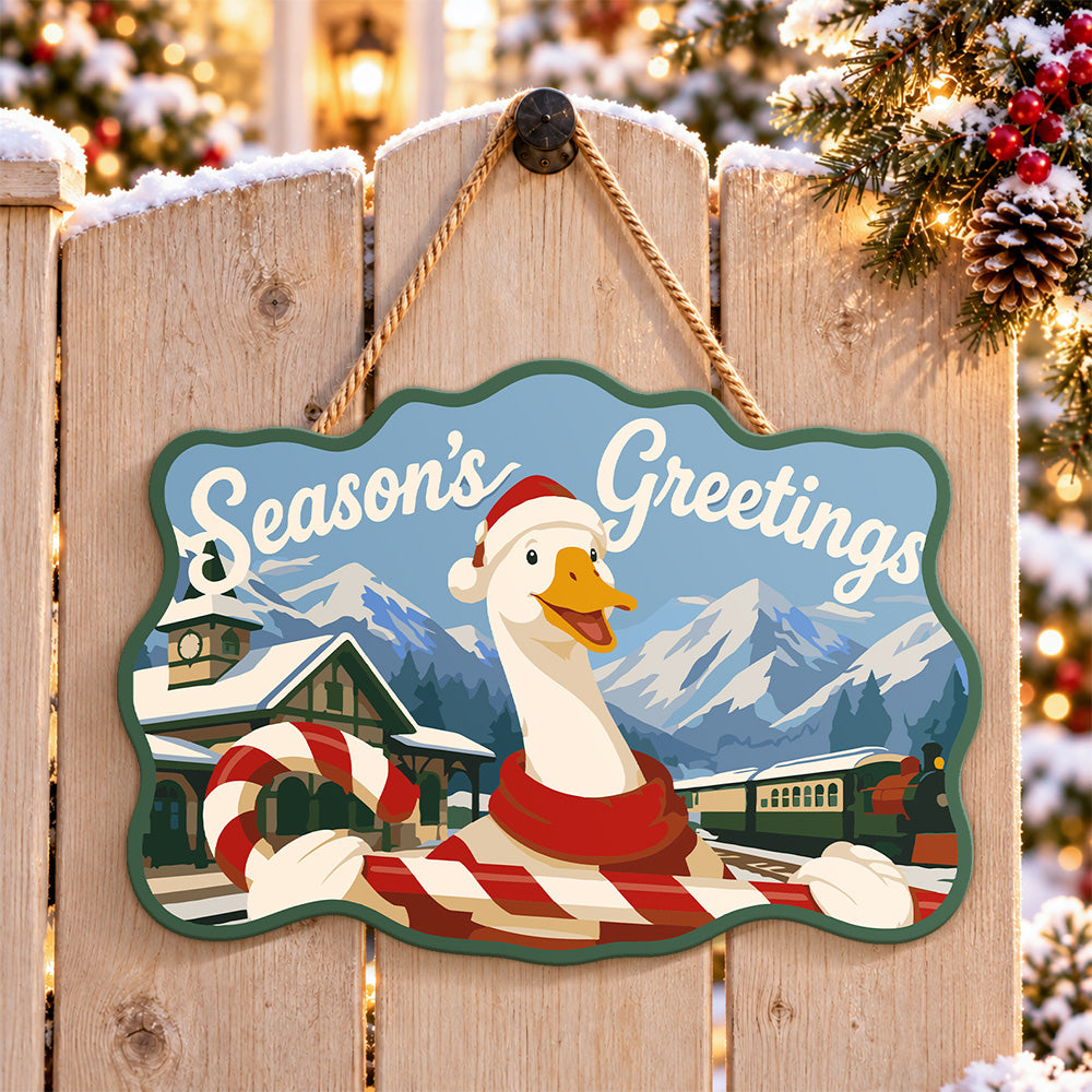 Festive goose with candy cane paint by numbers door hanger on a garden gate
