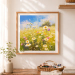 Finished field of white daisies under blue sky cross stitch artwork displayed as home decor