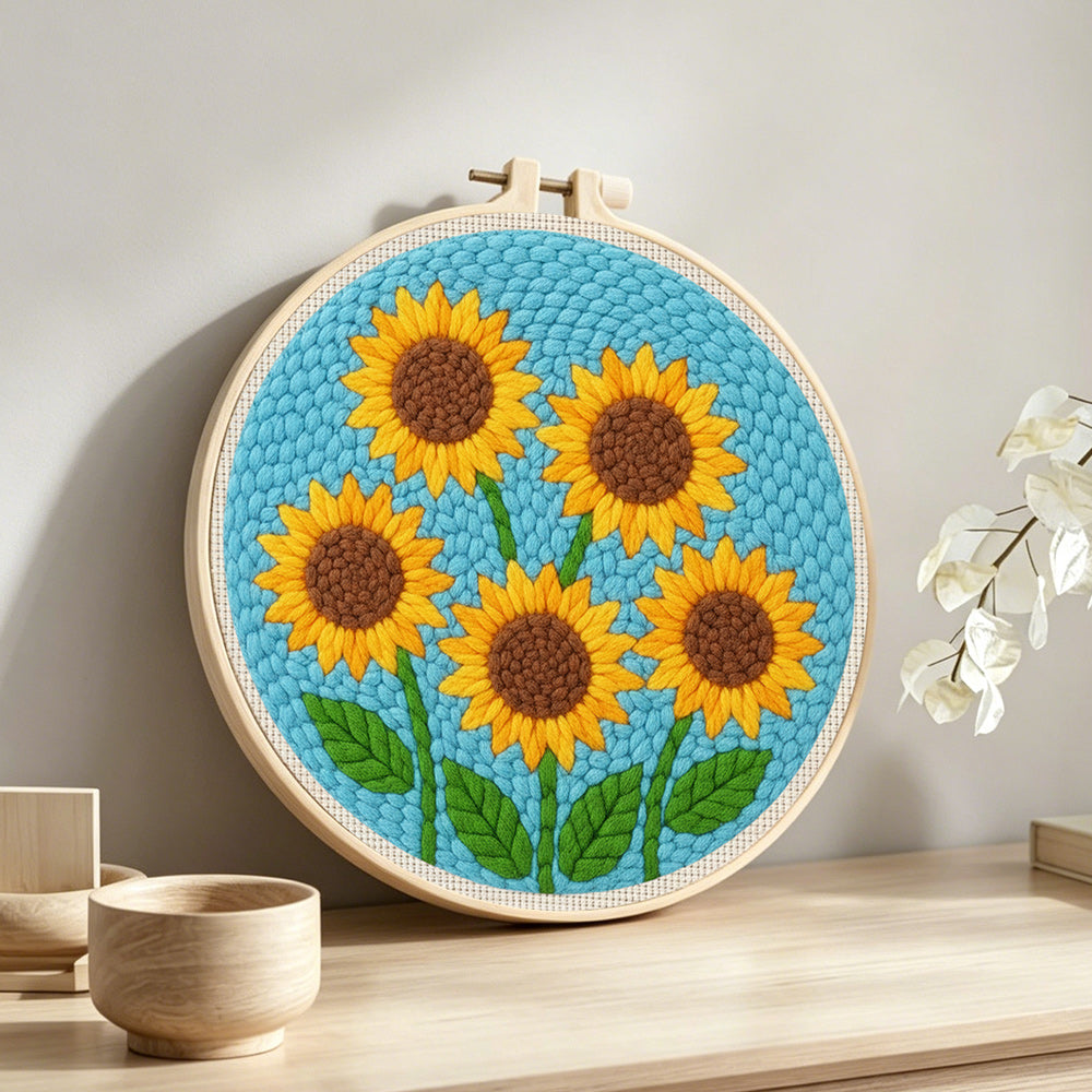 Five sunflowers punch needle artwork displayed on a table