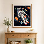 Finished floating among planets cross stitch artwork displayed as home decor