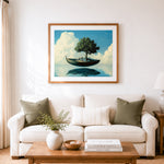 Finished floating boat with lone tree cross stitch artwork displayed as home decor