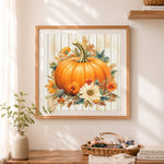 Finished floral autumn pumpkin cross stitch artwork displayed as home decor