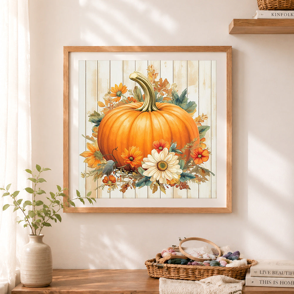 Finished floral autumn pumpkin cross stitch artwork displayed as home decor