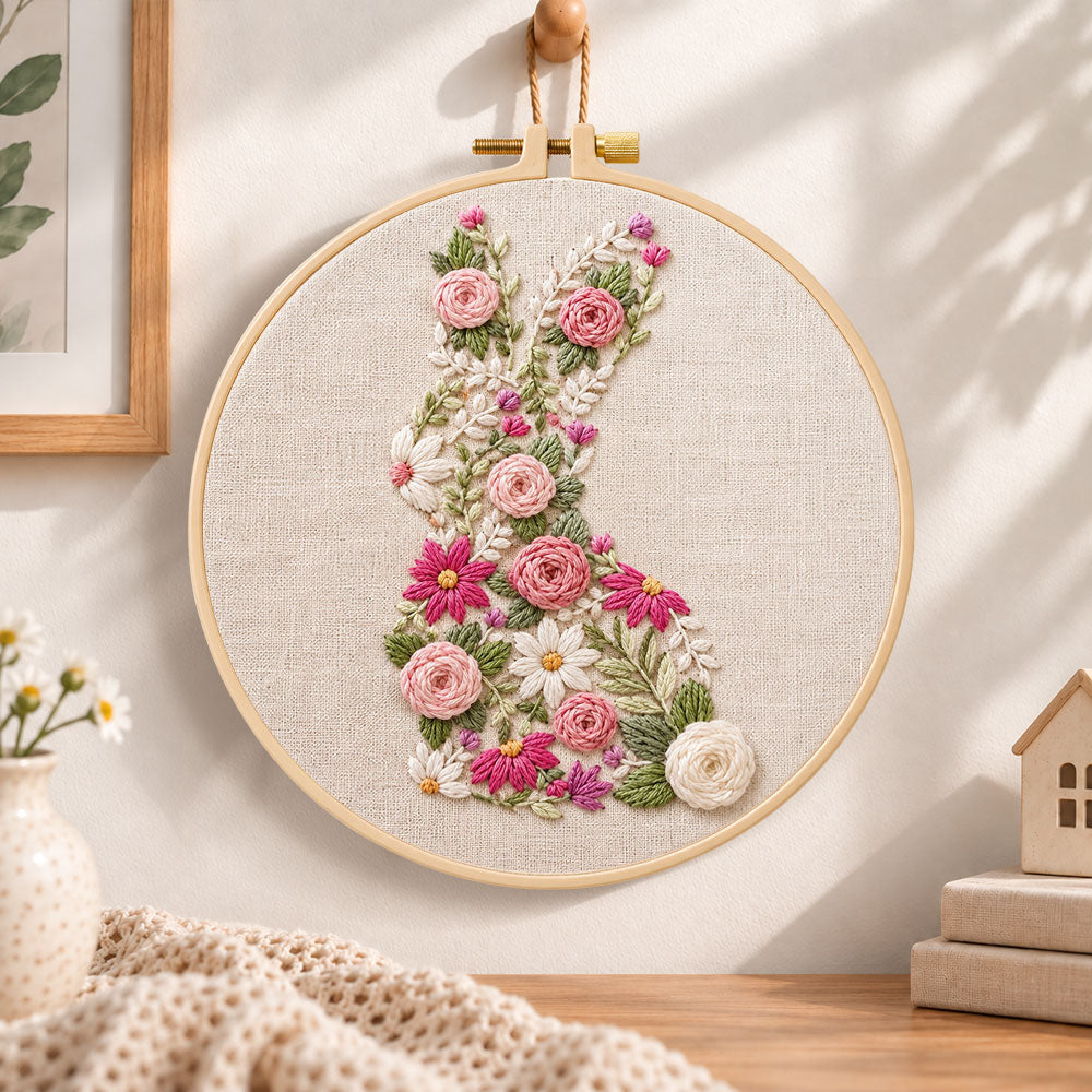 Floral bunny silhouette embroidery hoop wall art displayed as warm and cozy handmade home decor