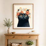 Finished floral crown black cat cross stitch artwork displayed as home decor