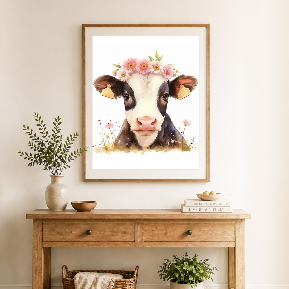 Finished floral crown dairy cow cross stitch artwork displayed as home decor
