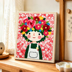 Floral crown girl and pink flowers punch needle artwork displayed on a table