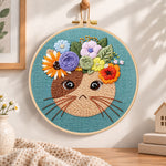 Floral crown kitty embroidery hoop wall art displayed as warm and cozy handmade home decor