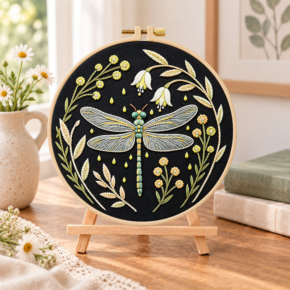 Floral dragonfly embroidery kit finished hoop displayed on a wooden stand as cozy tabletop decor