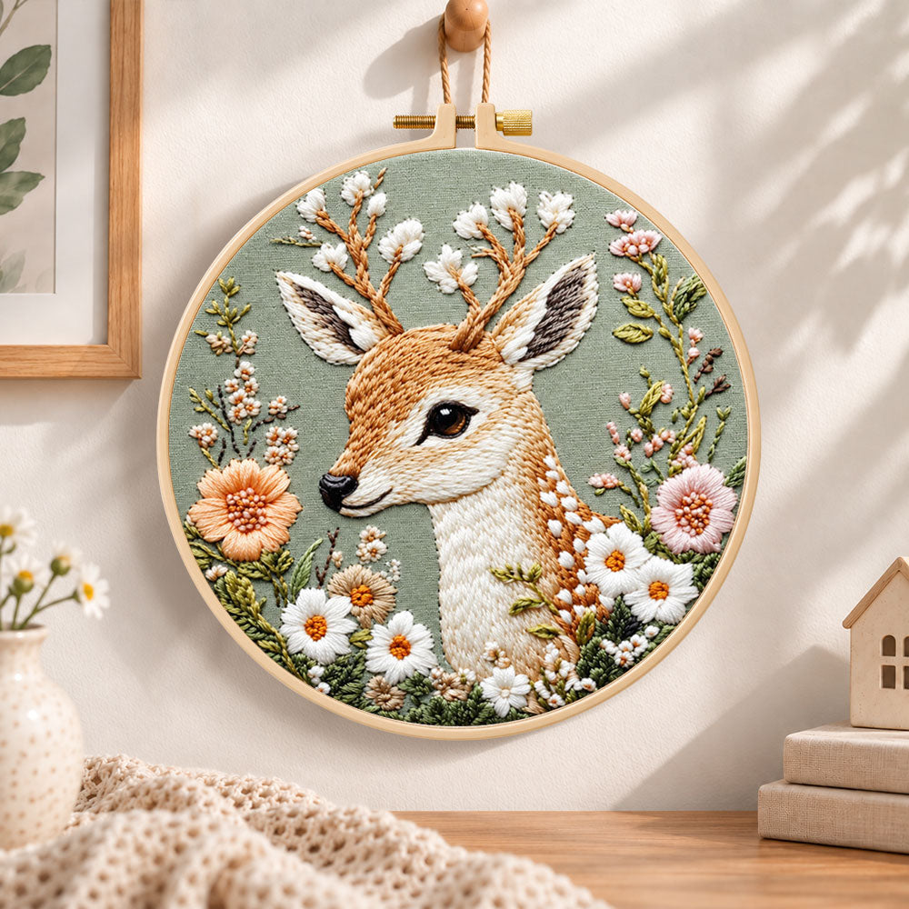 Floral fallow deer embroidery hoop wall art displayed as warm and cozy handmade home decor
